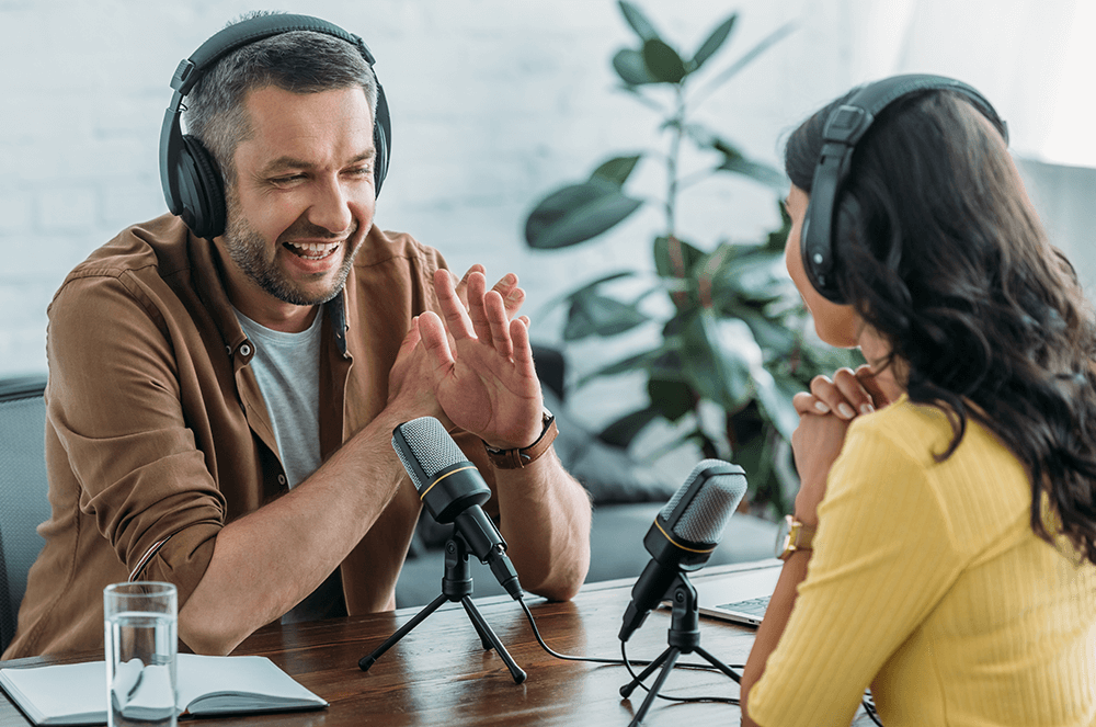 Business host speaking into a podcast microphone
