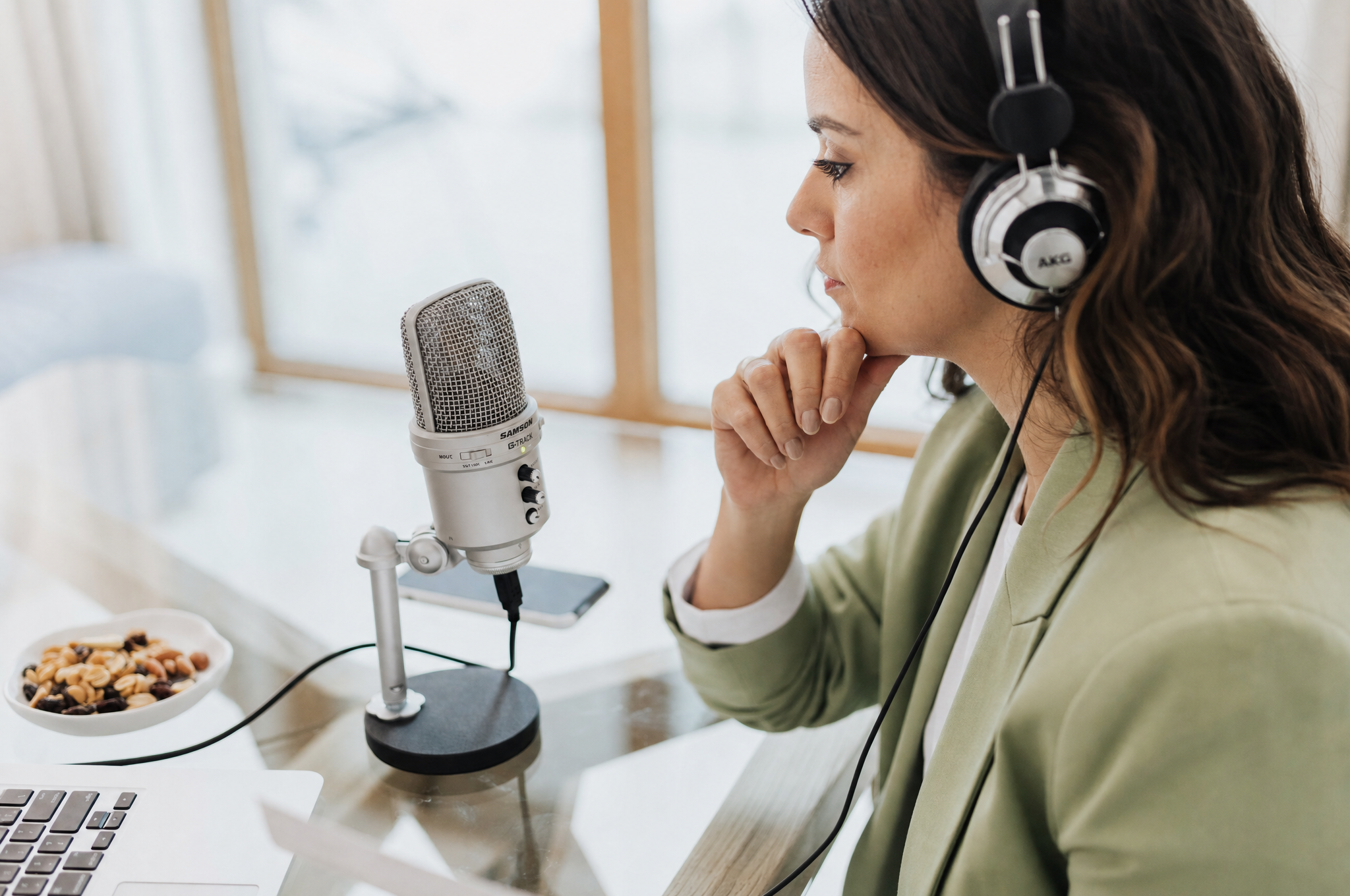 Professional podcast studio with microphones and soundproofing panels